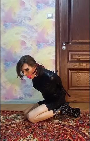 Crossdresser in armbinder gag and all other attributes