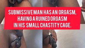 Submissive man has an orgasm, having a ruined orgasm in his small chastity cage.