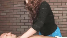 Ginger masseuse gives her client a handjob