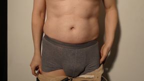 Close up man strips naked and wanks uncut cock until he is erect and gets dressed again