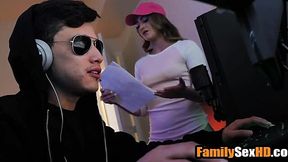 Step-sister gives rough blowjob while he plays video games