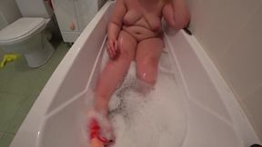 A Curvy Redhead Enjoys a Bath with Rubber Toys and Doggy Style Action