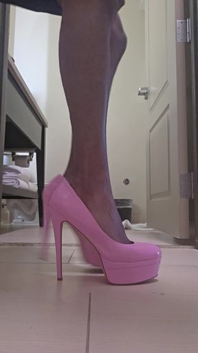 Pink platform heels and wearing a blue dress