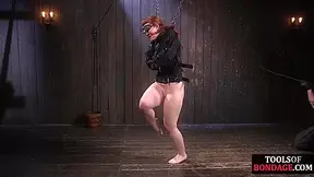 Curvy bdsm redhead whipped while bound and tied in chains