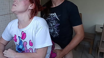 Hot redhead gets fucked in the kitchen by her stepbrother while washing the dishes