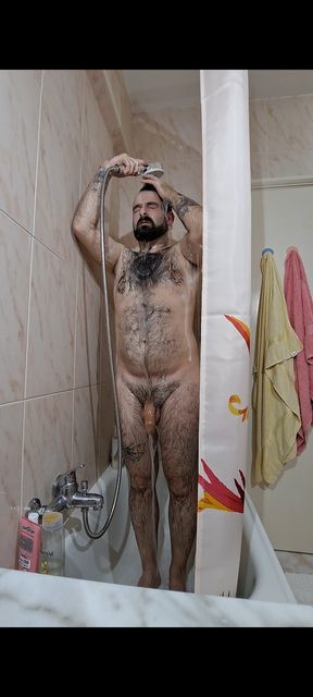 Furry bear takes a hot shower