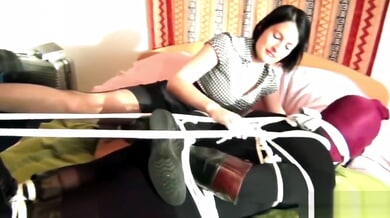 Dominant woman practices breath control on submissive partner during intense femdom session