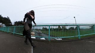 Crossdresser demonstrating on a highway bridge