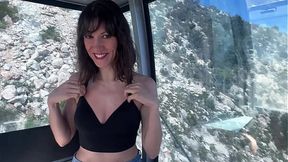 Solo girl with perfect tits and booty teases in public cable car