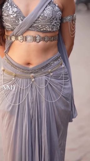 Indian babe plays with her belly button