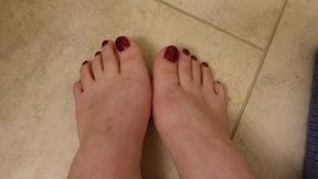 Quick New Pedicure Show off Glittery Red Toenails