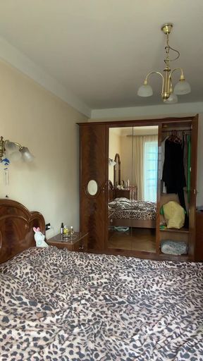 Bedroom with leopard print bedding