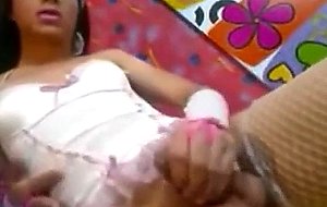 Sexy tranny in lingerie strokes her cock