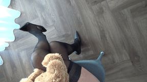 teddy bear sits astride my crossed legs 2TT