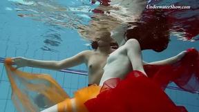 ”Mega sexy & wet lesbo girls swimming & stripping”