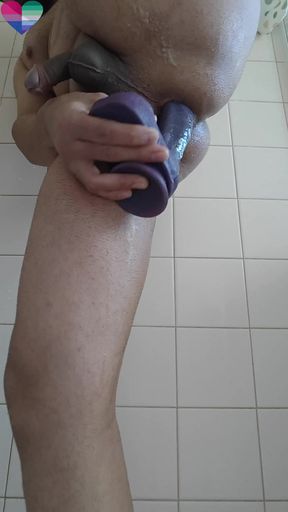 Man having fun with dildo while playing with his small cock