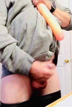 Comparing his little peanut to a big fat juicy dildo