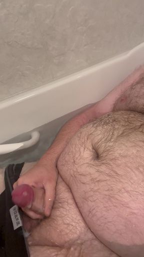 Chubby Fat Bear plays with small uncut cock in bathtub
