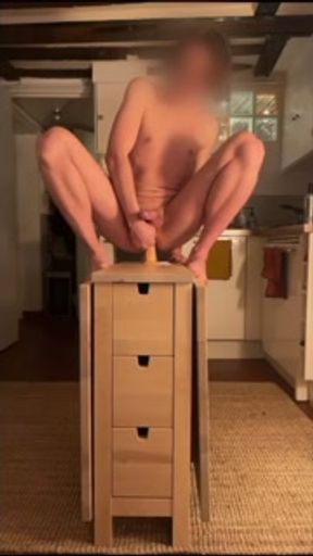 Boy rides a huge dildo in the kitchen