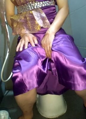 Crossdresser masturbation wearing satin purple longgown