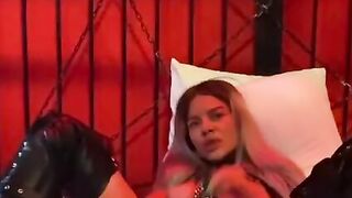 Adorable blonde women inside bondage suit and boots rough fucks her vagina with sex toy
