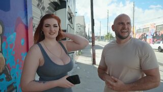 Bald stud fools around with curvaceous redhead in the streets