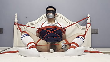 Asian boy tied to the bed, plugged by dildo and vibrated to cum