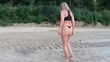 Granny walking outside in a string tanga!