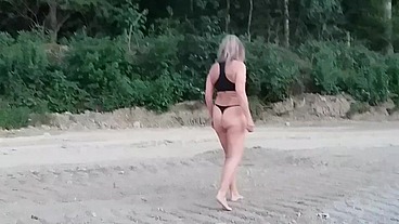 Granny walking outside in a string tanga!