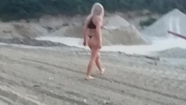 Granny walking outside in a string tanga!