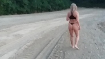Granny walking outside in a string tanga!
