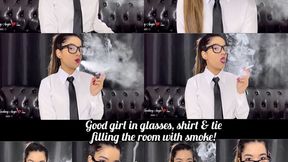 Good girl in glasses, shirt and tie filling the room with smoke!