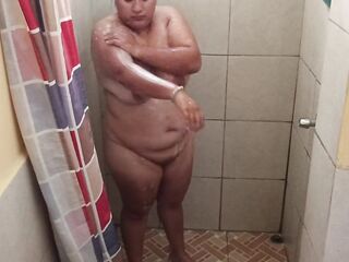 Taking a shower in a public restroom.