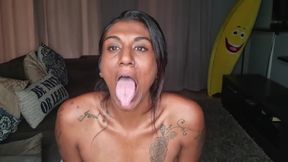 On the couch displaying my boobs, spit dripping down my tits as a constantly stick out my tongue