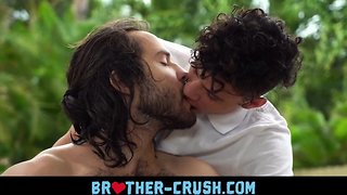 Haired older brother bursts up on y. sibling's face