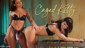 April Olsen And Charlie Valentine In Caged Kitty Anally Dominates