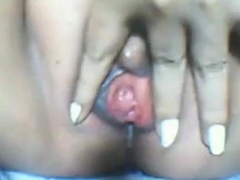 Mature Filipino manipulates pussy