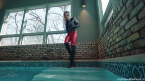 Camille in the Pool wearing a Red and Black Leather Outfit