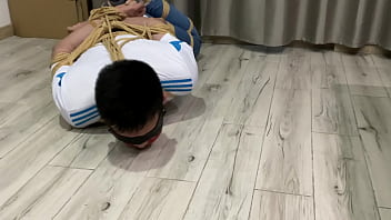 Asian boy hogtied and struggle