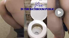 Urinating in a public restroom