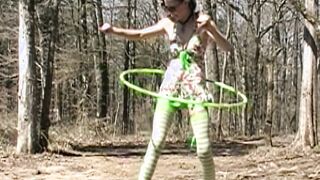 Mom into swimsuit plays with Hula Hoop