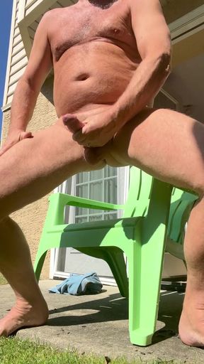 I'm jerking off naked in the back yard