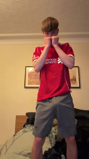 Man in red jersey posing shirtless