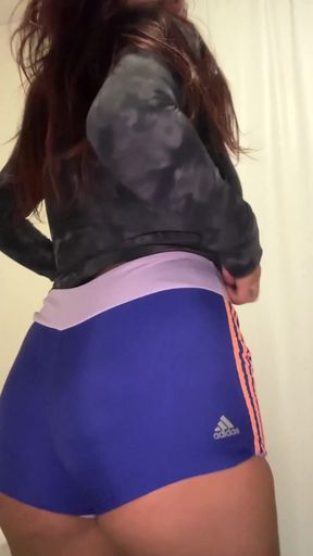 Sporty girl in blue shorts
