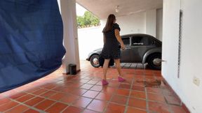 Teacher Barbara warms up and drives the old beetle to go to her class