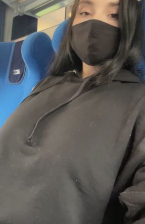 Woman in mask on train