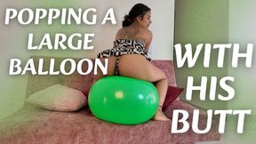 POPPING A LARGE BALLOON WITH HIS BUTT
