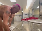 Caught completely naked while changing clothes in a mens restroom