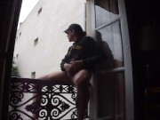 wanking on balcony