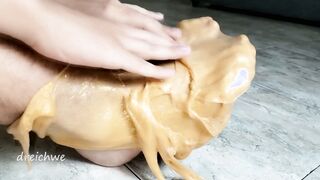 Watch this sexy escort's feet get worshiped by a pack of golden slimes